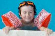 boy learning to swim