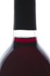 Single bottle of backlit red wine