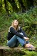 Beautiful brunette sitting outdoors