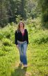 Pretty brunette walking through the field