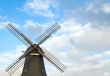 Old windmill against blue sky