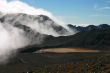 Volcano crater and cloud as fog over it