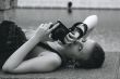 Young sexy woman with the camera