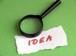 Idea, magnifier on green