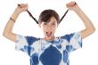 girl holding braids and shouting