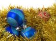 Christmas blue ornaments and gold tinsel