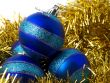 Christmas blue ornaments and gold tinsel