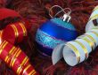 Christmas blue ball and ribbons on fluffy background