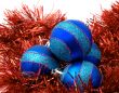 Christmas blue ornaments and red tinsel