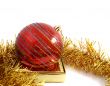 Christmas red ornaments and gold tinsel