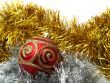 Christmas red ornaments and gold tinsel