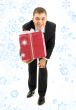 businessman with pink gift package and snowflakes
