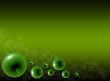 Green glass bubbles on a green background