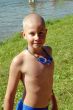 boy in googles on the beach