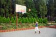 teen plays basketball