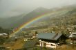 Rainbow across alpine village