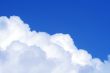 The blue sky and beautiful white clouds.