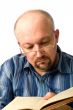 The man, reading the book.