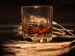 Whisky and wheat on dark