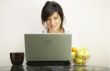 beautiful woman with laptop chair over white