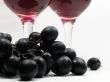 Red wine and grapes