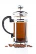 A coffee pot with beans