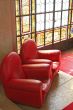 Sofas in waiting area with stained glass window