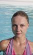 Beautiful young woman in the pool