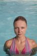 Beautiful young woman in the pool