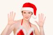 Studio portrait of a Christmas faerie counting 10
