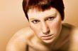 Studio portrait of a serious looking young woman with short hair