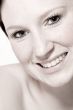 Studio portrait of a young woman with short hair flirting