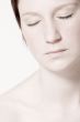 Studio portrait of a young woman with short hair relaxing