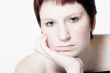 Studio portrait of a bored young woman with short hair