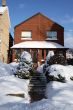 Snowed red-bricked house in downtown Toronto