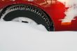 Car wheel stuck in the deep snow