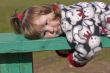 Girl lying on bench