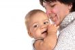 Smiling mother holding her baby