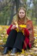 Woman with maple leaves