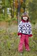 Kid standing in the fall forest