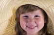 Happy laughing girl in straw