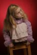 little girl in pink dress and winter coat