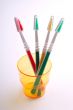 four tooth-brushes in  glass