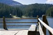 wooden bench on lake shore