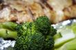 Close-up of baked pink salmon served with broccoli