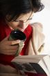 young beautiful woman is reading a book