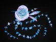 artificial rose and blue bellflowers