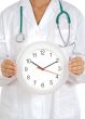 Doctor showing clock