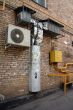 air conditioner on the brick wall with airshaft