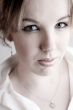 Portrait of a hypnotizing blond curly woman
